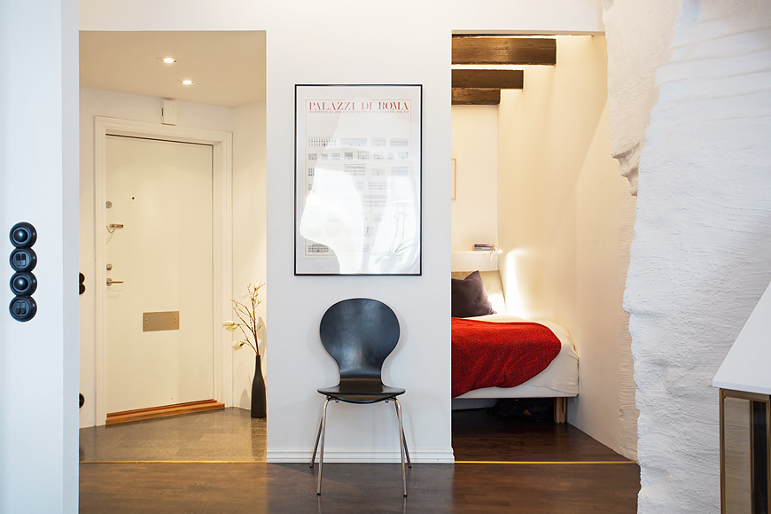 black-chair-and-wooden-floor-laminating-plus-red-blanket-with-white-brick-wall-paint-as-well-as-good-idea-lightig-for-room